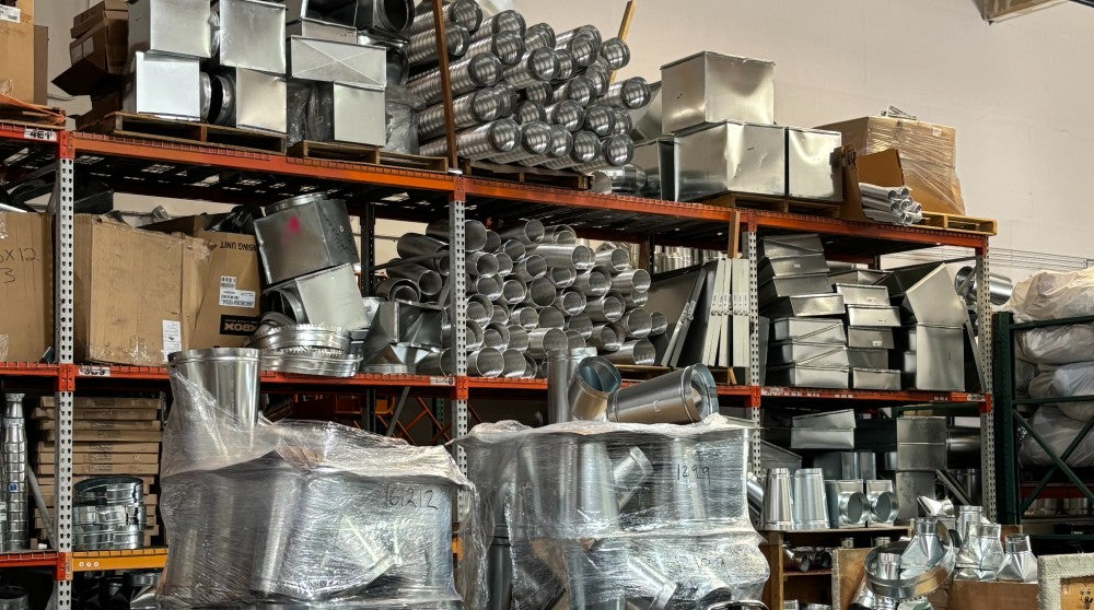 Duct parts on shelves at HVAC wholesale distributor.